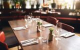 Glasses and cutlery on table in restaurant
