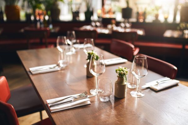 Glasses and cutlery on table in restaurant