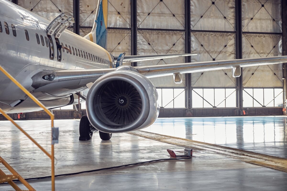 Passenger aircraft on service in an aviation hangar