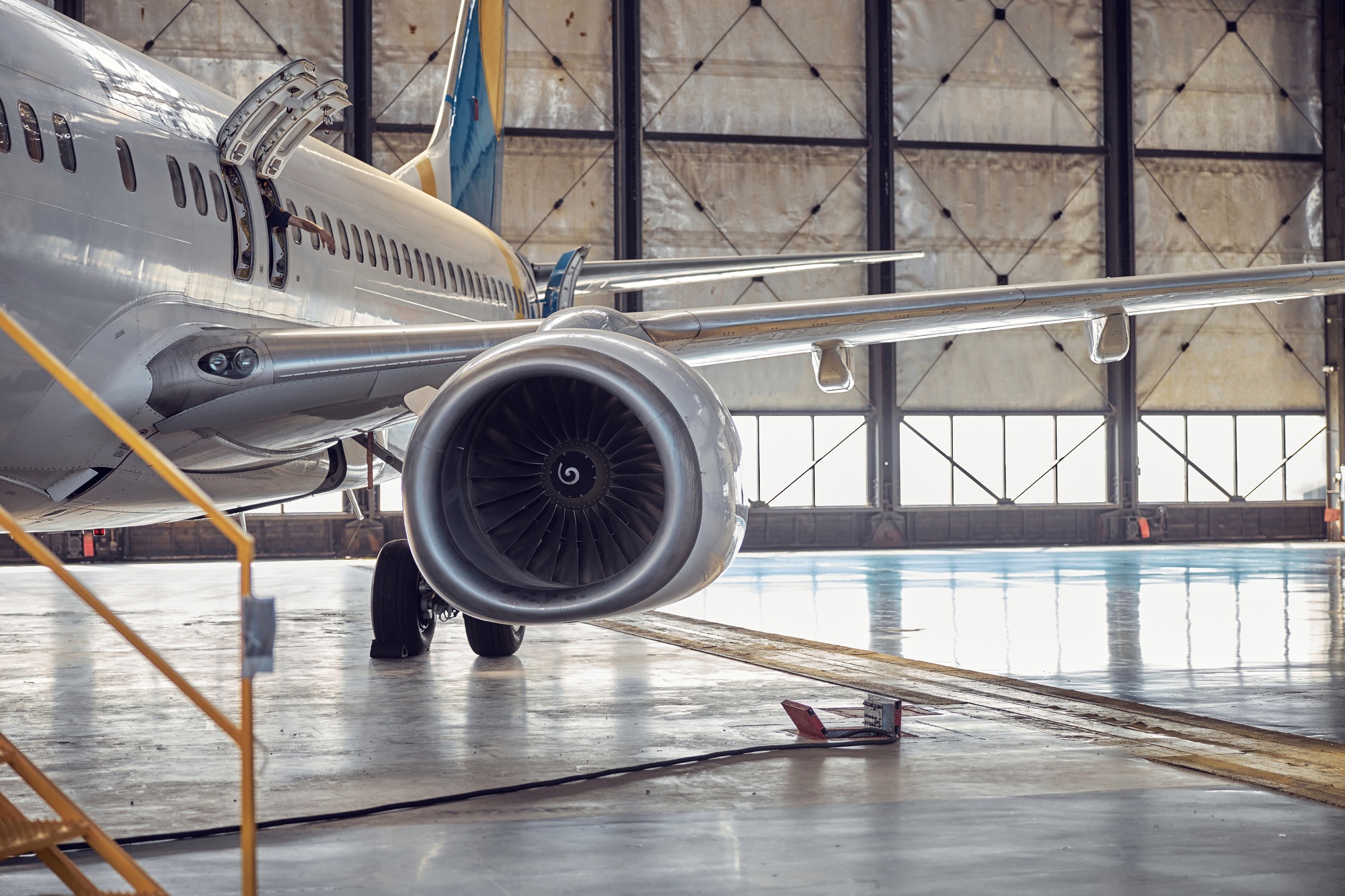 Passenger aircraft on service in an aviation hangar