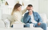 Take care. Woman touching forehead of ill husband