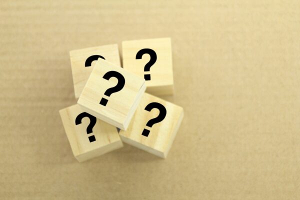 wooden cube with question mark.
